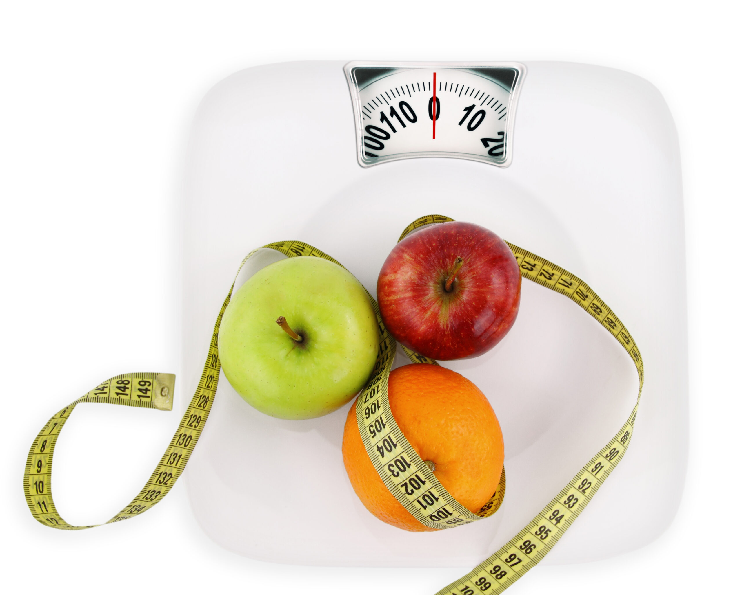 Diet concept. Fruits with measuring tape on a plate like weight scale